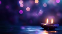 Traditional oil lamp with twin flames glowing warmly against dreamy purple bokeh lights background creating peaceful meditation atmosphere for wellness content.