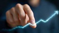 Finger touching glowing upward trend line graph on dark background showing business growth and success analytics for financial presentations.