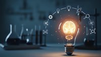 Glowing light bulb with brain inside surrounded by innovation icons on blurred laboratory background representing creative thinking and scientific discovery.