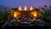 Outdoor campfire setup with five glowing lanterns arranged on wooden logs and stones in misty forest clearing at dusk for camping and nature themes.