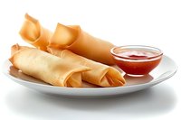 Crispy spring rolls served on white ceramic plate with sweet chili dipping sauce, traditional Asian appetizer photographed with soft lighting and selective focus.