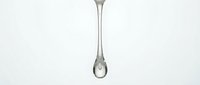 Single water droplet suspended from thin stream against white background, isolated and ready for design use on websites, apps, environmental campaigns, and marketing materials.