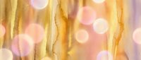 Abstract watercolor background with golden yellow flowing lines and soft pink bokeh circles creating dreamy artistic texture for creative projects.