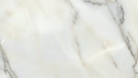 Elegant white marble surface with natural gray veining patterns for luxury interior design and architectural applications.