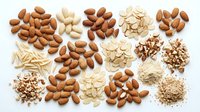 Assorted nuts and seeds including almonds, cashews, peanuts, and sesame on white background, isolated for food packaging, culinary design, and nutritional content projects.