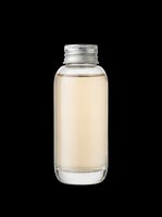 Glass bottle with light amber liquid and silver metal cap, isolated on transparent background. Ready for t-shirt design, stickers, clipart, and print on demand use.
