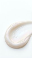 Creamy white cosmetic texture swirl isolated on white background for skincare and beauty product design applications.