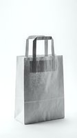 Minimalist gray paper shopping bag with handles isolated on white background for retail and commercial design projects.