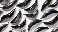 Purple eggplant slices arranged in diagonal rows creating geometric pattern on white background, fresh organic produce for food and restaurant design.