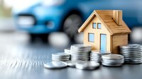 Wooden house model with stacks of coins and blurred car background representing real estate investment, mortgage planning, property financing and insurance concepts.