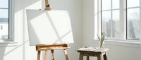 Bright artist studio with wooden easel holding blank white canvas, natural sunlight streaming through large windows creating inspiring creative workspace for painting.