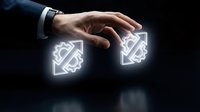 Business hand reaching for glowing digital gears on dark background representing technology innovation and automation solutions for corporate growth.