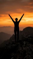 Silhouette of victorious person with raised arms celebrating success on mountain peak at golden sunset with dramatic orange sky and layered hills.