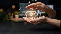 Hands holding glowing organizational chart with connected boxes, representing corporate hierarchy, business structure, and management system for enterprise planning and workflow visualization.