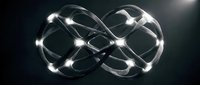 Glowing infinity symbol with luminous nodes on dark background representing endless possibilities, eternity, and continuous flow for technology and business concepts.