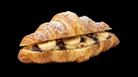Croissant sandwich filled with chocolate and banana slices, dusted with powdered sugar, isolated on transparent background ready for bakery menus, food blogs, cafe designs, print materials and culinary graphics.