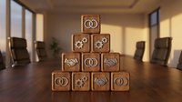 Wooden blocks stacked in pyramid formation displaying gears and interconnected symbols on conference table, representing teamwork, business strategy, and organizational structure for corporate communications.