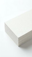 Stack of blank white paper sheets with textured surface isolated on white background, ready for printing, stationery design, business cards, or office supplies.