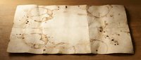 Aged parchment paper with coffee stains and worn edges on wooden surface for vintage design projects and historical themed backgrounds.