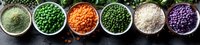 Colorful assortment of legumes and grains in bowls including green peas, lentils, rice, and beans on dark background for healthy cooking.