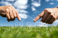 Hands framing digital house outline against blue sky and green grass, representing real estate technology and smart home innovation in modern living.