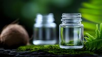 Natural skincare ingredients with glass jars, moss and green plants for organic beauty products and wellness treatments.