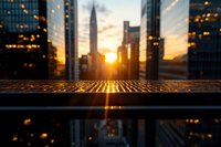 Sunrise over metropolitan skyline with illuminated skyscrapers and golden light reflecting on wet street surface, urban cityscape at dawn.