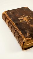 Antique leather-bound book with worn brown cover and gold embossed text, featuring aged pages and traditional binding. Suitable for historical, literary, and educational content.