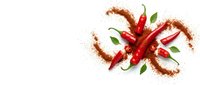 Fresh red chili peppers with ground spice powder and green leaves, isolated on white background, top view flat lay for food and culinary design.