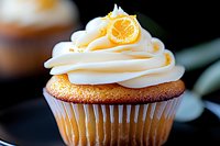 Orange vanilla cupcake with swirled buttercream frosting topped with candied citrus slice on dark background, macro food photography for bakery marketing.