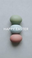 Three pastel Easter eggs in sage green, light blue, and blush pink arranged vertically on gray background with Happy Easter text.