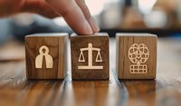 Wooden blocks with legal and justice symbols including scales of justice, person silhouette and brain icon, perfect for law firm marketing, legal services or court system concepts.