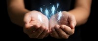 Hands holding glowing human figures with upward arrows representing growth, leadership development, team building and business success concepts.