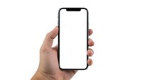 Hand holding modern smartphone with blank white screen isolated on white background for mobile app mockup and digital presentation.