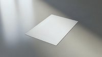 Clean white paper sheet on modern surface with dramatic lighting for professional presentations and mockup designs.