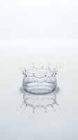 Water crown splash with droplets and reflection on white background isolated for design and advertising projects.