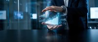 Professional businessman holding glowing digital hologram with data analytics and charts in modern office environment for technology presentations.
