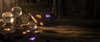 Mystical crystal balls with glowing magical lights on rustic wooden surface creating enchanting fortune telling atmosphere for spiritual divination practices.