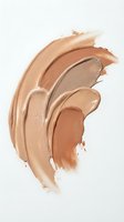 Creamy foundation makeup smears in nude beige tones on white background for cosmetic advertising and beauty product campaigns.