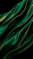 Luxurious emerald green silk fabric with flowing gold and bronze stripes creates an elegant, flowing wave pattern against a dark background. Perfect for luxury branding, fashion design, and premium product packaging.