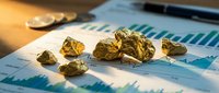 Gold nuggets scattered on financial charts and graphs showing market analysis data for precious metals investment and commodity trading.