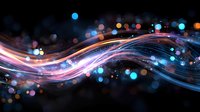 Abstract flowing light waves with colorful bokeh effect on dark background, creating dynamic motion and energy for technology or communication concepts.