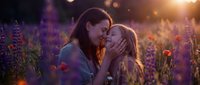 Mother and daughter sharing tender moment in purple wildflower field during golden hour sunset. Loving family bonding outdoors in nature meadow.