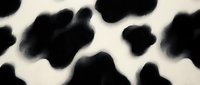Seamless cow spot pattern with black organic shapes on cream background, tiles into continuous repeating design for textile and surface applications.