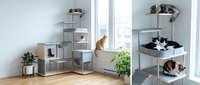Modern cat tree furniture with multiple levels and cozy beds for feline climbing, resting and playing in bright contemporary home interior.