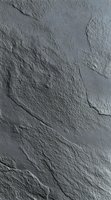 Gray stone texture with natural rough surface and irregular cracks creates dramatic depth and shadow effect for architectural and design applications.