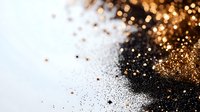 Luxurious gold and black glitter particles scattered on white background, creating elegant contrast for festive designs and luxury branding.
