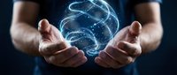 Caucasian man holding a glowing blue energy sphere with swirling light particles, symbolizing power, technology, and innovation on dark background.