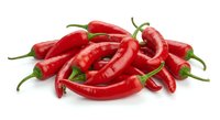 Fresh red chili peppers isolated on white background for cooking, spice blends, hot sauce recipes and culinary ingredient designs.
