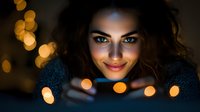 Young woman with olive skin tone and dark wavy hair holding warm glowing lights, wearing cozy sweater for winter holiday, festive season, and lifestyle content.